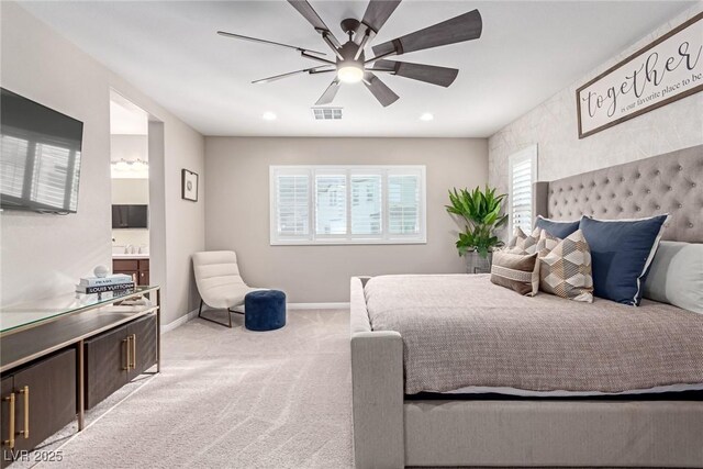 3929 Reyes Ave, Las Vegas, NV 89141 - bedroom with baseboards, light carpet, recessed lighting, ensuite bathroom, and ceiling fan