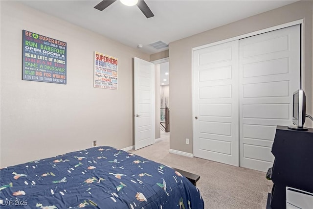 3929 Reyes Ave, Las Vegas, NV 89141 - bedroom featuring light carpet, baseboards, a closet, and ceiling fan