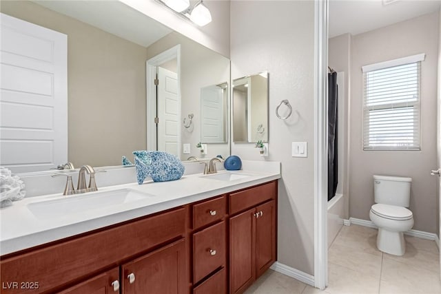 3929 Reyes Ave, Las Vegas, NV 89141 - full bath with double vanity, toilet, shower / tub combo with curtain, baseboards, and tile patterned floors