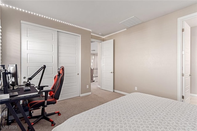 3929 Reyes Ave, Las Vegas, NV 89141 - bedroom featuring baseboards, carpet, a closet, and an office area