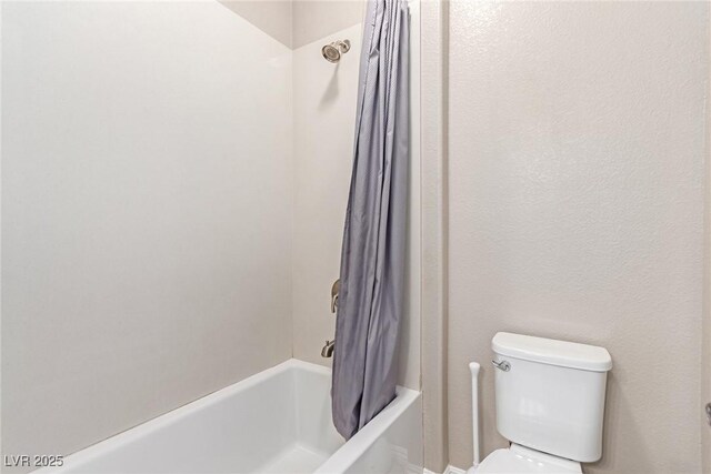 3929 Reyes Ave, Las Vegas, NV 89141 - bathroom with shower / bath combination with curtain and toilet