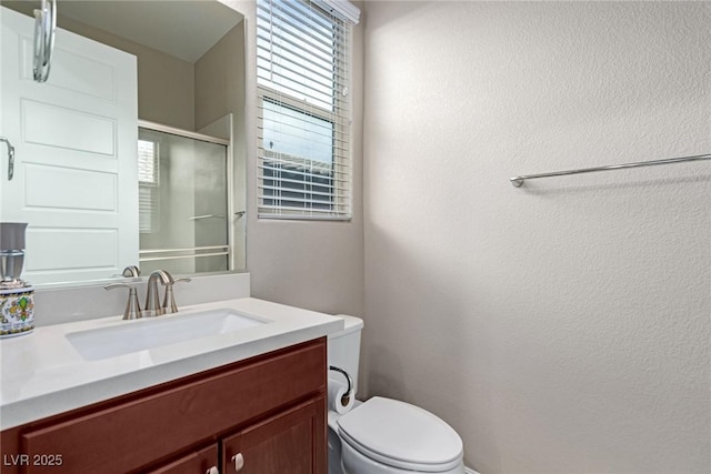 3929 Reyes Ave, Las Vegas, NV 89141 - full bathroom featuring vanity, toilet, and a shower with door
