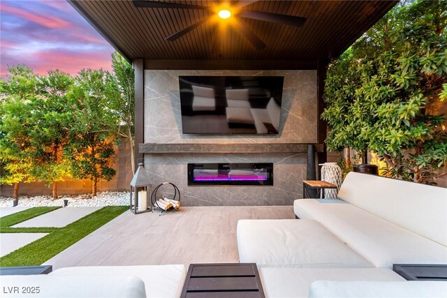 3929 Reyes Ave, Las Vegas, NV 89141 - view of patio / terrace featuring an outdoor living space with a fireplace and ceiling fan