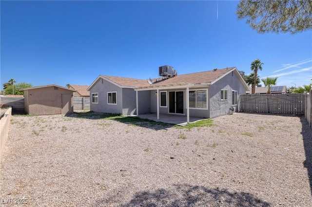 5535 Oxbow St, Las Vegas, NV 89119 - back of house featuring a fenced backyard, a patio area, stucco siding, and central air condition unit