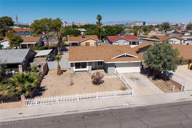 5535 Oxbow St, Las Vegas, NV 89119 - view of front of house featuring a fenced front yard, a garage, a residential view, and concrete driveway