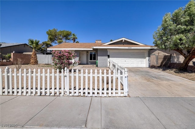 5535 Oxbow St, Las Vegas, NV 89119 - ranch-style home featuring a garage, a fenced front yard, concrete driveway, and stucco siding