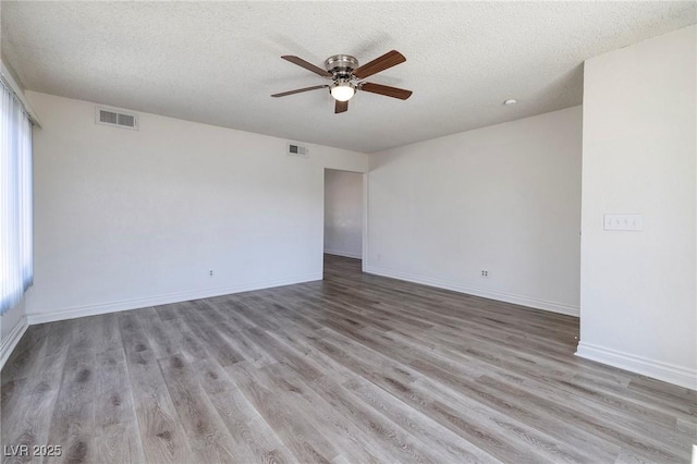 5535 Oxbow St, Las Vegas, NV 89119 - unfurnished room with a ceiling fan, a textured ceiling, wood finished floors, and baseboards