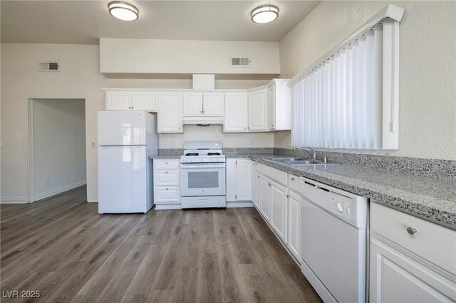 5535 Oxbow St, Las Vegas, NV 89119 - kitchen featuring white appliances, a sink, white cabinetry, and dark wood-style flooring