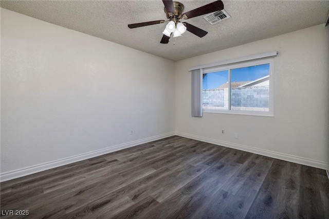 5535 Oxbow St, Las Vegas, NV 89119 - spare room featuring a textured ceiling, dark wood-type flooring, baseboards, and a ceiling fan