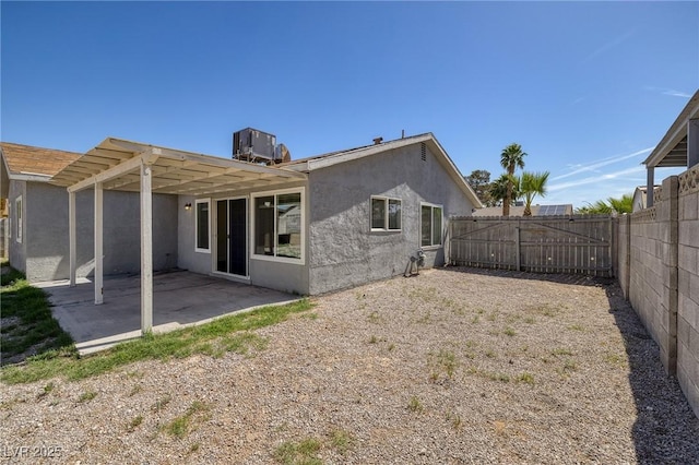 5535 Oxbow St, Las Vegas, NV 89119 - back of house featuring a patio area, a fenced backyard, stucco siding, cooling unit, and a pergola