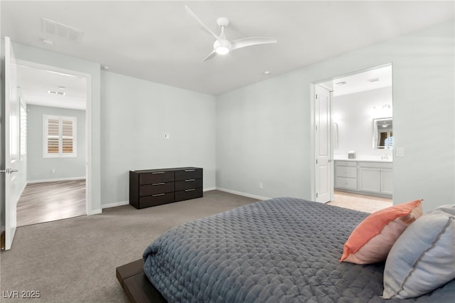 424 Vigo Port St, Las Vegas, NV 89138 - bedroom with light colored carpet, baseboards, connected bathroom, and ceiling fan
