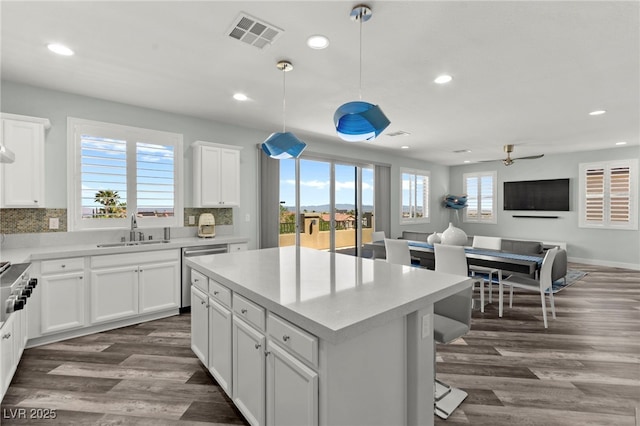 424 Vigo Port St, Las Vegas, NV 89138 - kitchen with stainless steel dishwasher, a sink, open floor plan, recessed lighting, and dark wood-style floors