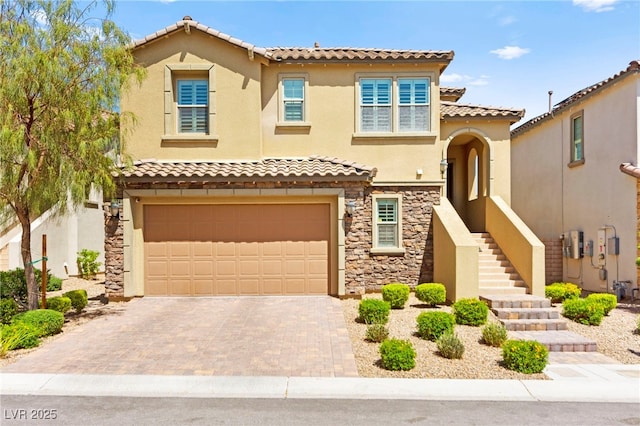 424 Vigo Port St, Las Vegas, NV 89138 - mediterranean / spanish-style house with stone siding, a garage, a tiled roof, and stucco siding