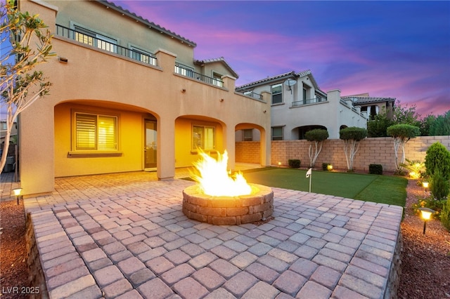424 Vigo Port St, Las Vegas, NV 89138 - view of patio / terrace featuring a fire pit and a putting green