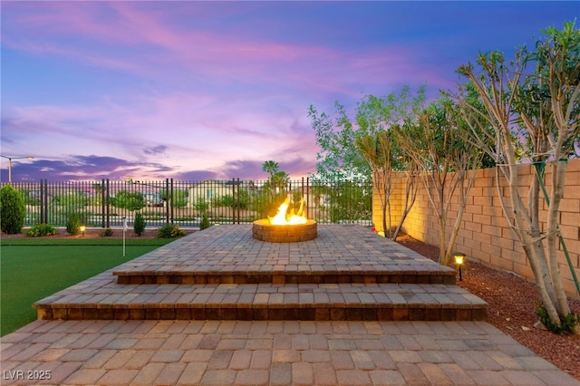 424 Vigo Port St, Las Vegas, NV 89138 - fenced backyard with an outdoor fire pit, an area to practice putting, and a patio area
