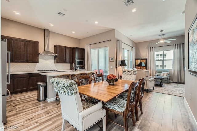 2507 Silent View Ave, Henderson, NV 89044 - dining area with light wood-style flooring, a ceiling fan, baseboards, and recessed lighting