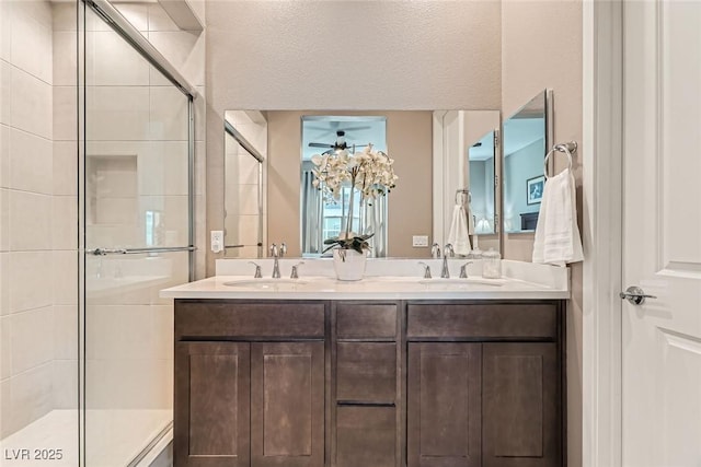 2507 Silent View Ave, Henderson, NV 89044 - full bath featuring a shower stall, double vanity, and a ceiling fan