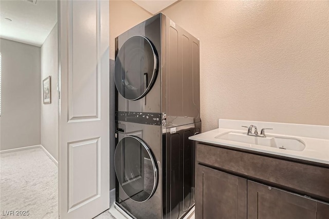 2507 Silent View Ave, Henderson, NV 89044 - washroom with stacked washer and clothes dryer and light colored carpet