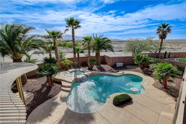 5949 Casa Coronado Ave, Las Vegas, NV 89131 - view of pool with a fenced backyard, a mountain view, and a pool with connected hot tub