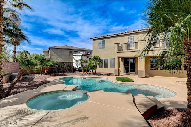 5949 Casa Coronado Ave, Las Vegas, NV 89131 - view of swimming pool with a patio, a fenced backyard, and a pool with connected hot tub