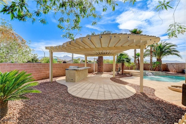 5949 Casa Coronado Ave, Las Vegas, NV 89131 - fenced backyard featuring a pergola and a patio area