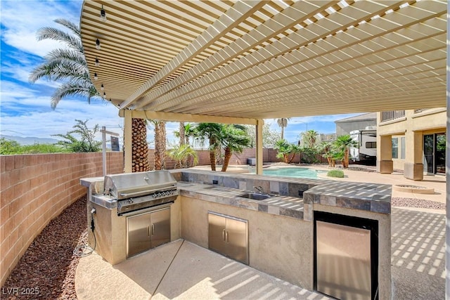 5949 Casa Coronado Ave, Las Vegas, NV 89131 - fenced backyard with a sink and a patio area