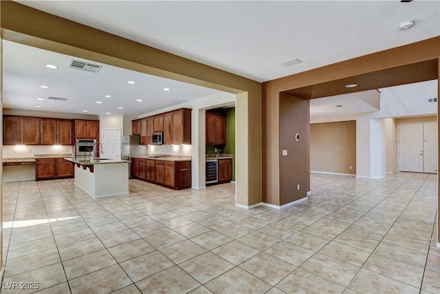 5949 Casa Coronado Ave, Las Vegas, NV 89131 - kitchen with light tile patterned floors, beverage cooler, open floor plan, stainless steel appliances, and recessed lighting