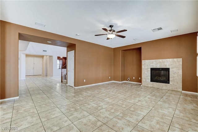 5949 Casa Coronado Ave, Las Vegas, NV 89131 - unfurnished living room with light tile patterned flooring, ceiling fan, a tile fireplace, and baseboards