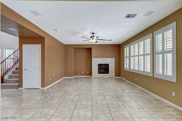 5949 Casa Coronado Ave, Las Vegas, NV 89131 - unfurnished living room featuring a ceiling fan, light tile patterned floors, baseboards, and a tiled fireplace