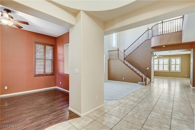 5949 Casa Coronado Ave, Las Vegas, NV 89131 - unfurnished room with a ceiling fan, stairway, baseboards, and wood finished floors