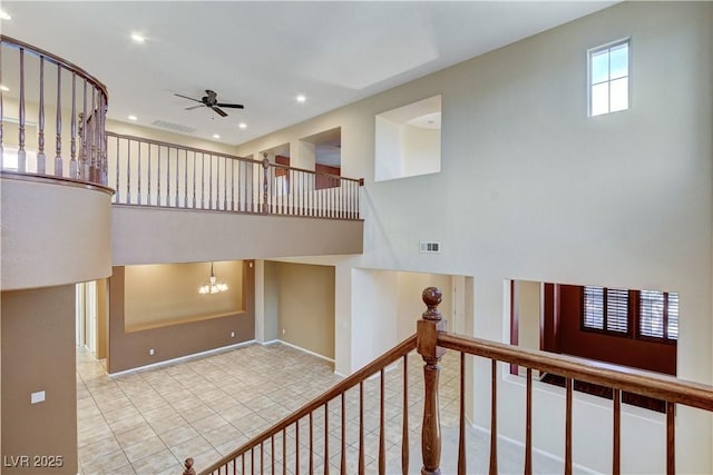 5949 Casa Coronado Ave, Las Vegas, NV 89131 - stairway featuring a ceiling fan, recessed lighting, tile patterned floors, a chandelier, and baseboards