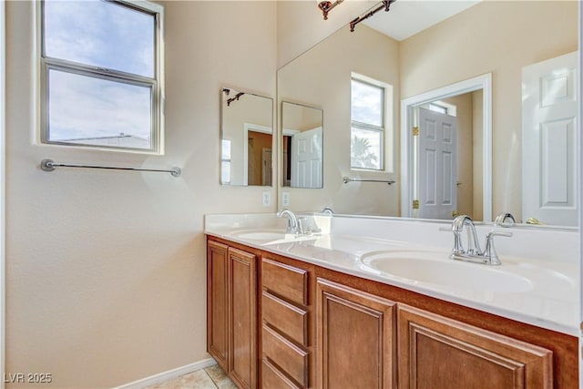 5949 Casa Coronado Ave, Las Vegas, NV 89131 - bathroom featuring double vanity and baseboards