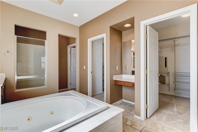 5949 Casa Coronado Ave, Las Vegas, NV 89131 - bathroom with a tub with jets, tile patterned flooring, vanity, baseboards, and recessed lighting