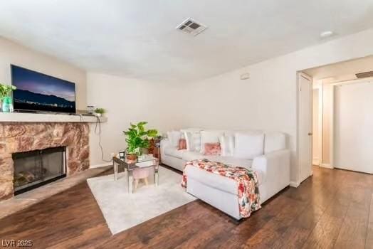 904 Boulder Springs Dr Unit 102, Las Vegas, NV 89128 - living room featuring wood finished floors and a fireplace