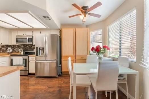 904 Boulder Springs Dr Unit 102, Las Vegas, NV 89128 - kitchen featuring stainless steel appliances, ceiling fan, tasteful backsplash, wood finished floors, and light countertops