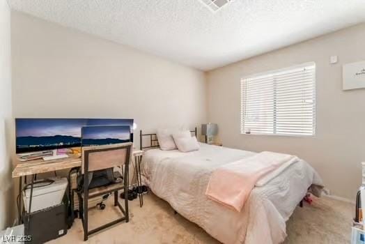 904 Boulder Springs Dr Unit 102, Las Vegas, NV 89128 - bedroom featuring carpet flooring and a textured ceiling
