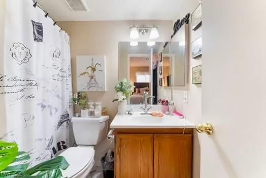 904 Boulder Springs Dr Unit 102, Las Vegas, NV 89128 - full bathroom with toilet, vanity, and a shower with curtain