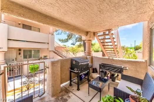 904 Boulder Springs Dr Unit 102, Las Vegas, NV 89128 - view of patio / terrace featuring stairs, grilling area, and an outdoor hangout area