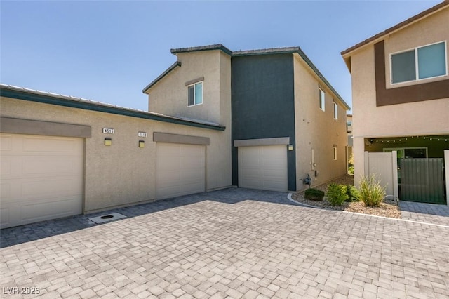 4519 Sapphire Moon Ave, North Las Vegas, NV 89084 - view of front of home featuring decorative driveway, stucco siding, and an attached garage