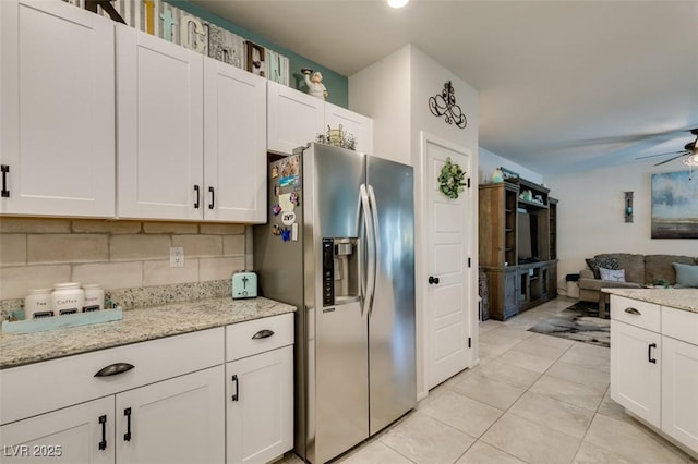 4519 Sapphire Moon Ave, North Las Vegas, NV 89084 - kitchen featuring stainless steel refrigerator with ice dispenser, ceiling fan, backsplash, and white cabinetry