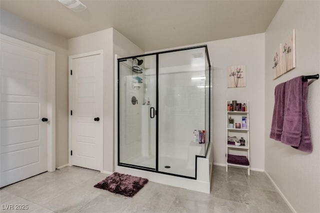 4519 Sapphire Moon Ave, North Las Vegas, NV 89084 - bathroom with a stall shower, baseboards, and tile patterned flooring