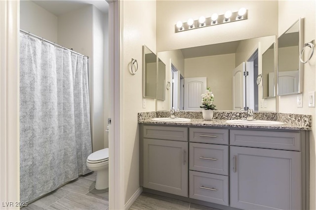 7265 Southern Magnolia St, Las Vegas, NV 89149 - full bathroom featuring double vanity and toilet