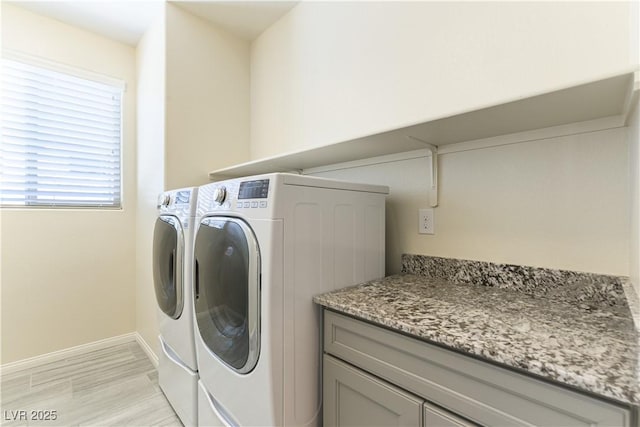 7265 Southern Magnolia St, Las Vegas, NV 89149 - laundry area featuring separate washer and dryer, baseboards, and light wood-style flooring