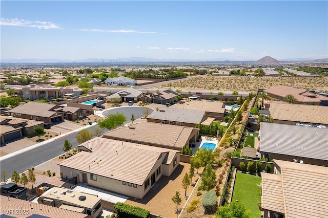 7265 Southern Magnolia St, Las Vegas, NV 89149 - aerial view of residential area featuring a mountain backdrop and a pool area