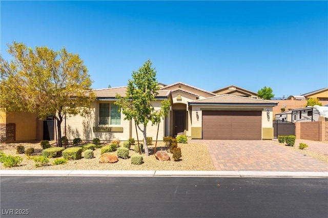 7265 Southern Magnolia St, Las Vegas, NV 89149 - ranch-style home with a garage, driveway, and stucco siding