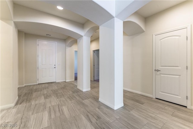 7265 Southern Magnolia St, Las Vegas, NV 89149 - foyer entrance with arched walkways, baseboards, recessed lighting, and light wood-style flooring