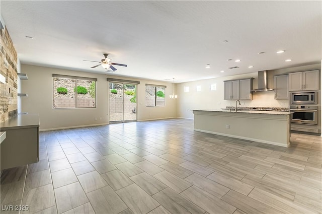 7265 Southern Magnolia St, Las Vegas, NV 89149 - unfurnished living room featuring a ceiling fan, recessed lighting, baseboards, and a sink
