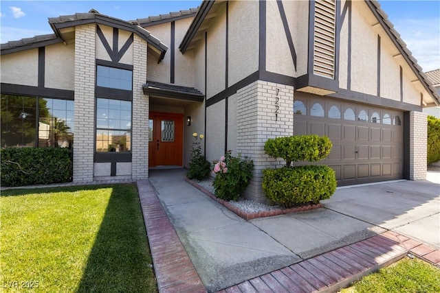 7221 W Washington Ave, Las Vegas, NV 89128 - view of front of property with stucco siding, brick siding, a front lawn, and driveway