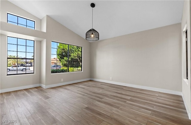 7221 W Washington Ave, Las Vegas, NV 89128 - spare room featuring light wood finished floors, high vaulted ceiling, and baseboards