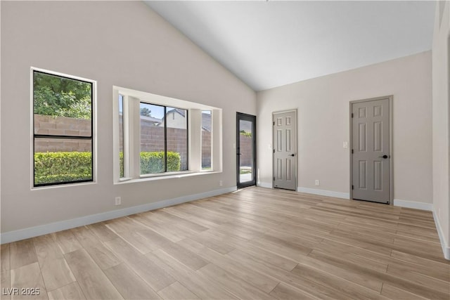 7221 W Washington Ave, Las Vegas, NV 89128 - unfurnished room with high vaulted ceiling, light wood-type flooring, and baseboards